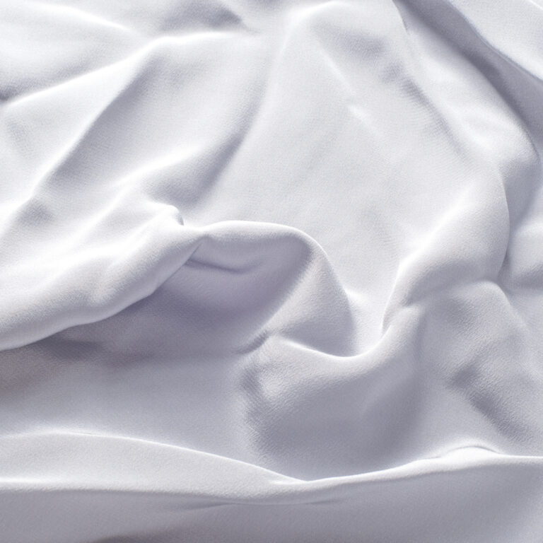 texture lace. a fine open fabric, typically one of cotton or silk, made by looping, twisting, or knitting thread in patterns and used especially for trimming garments.