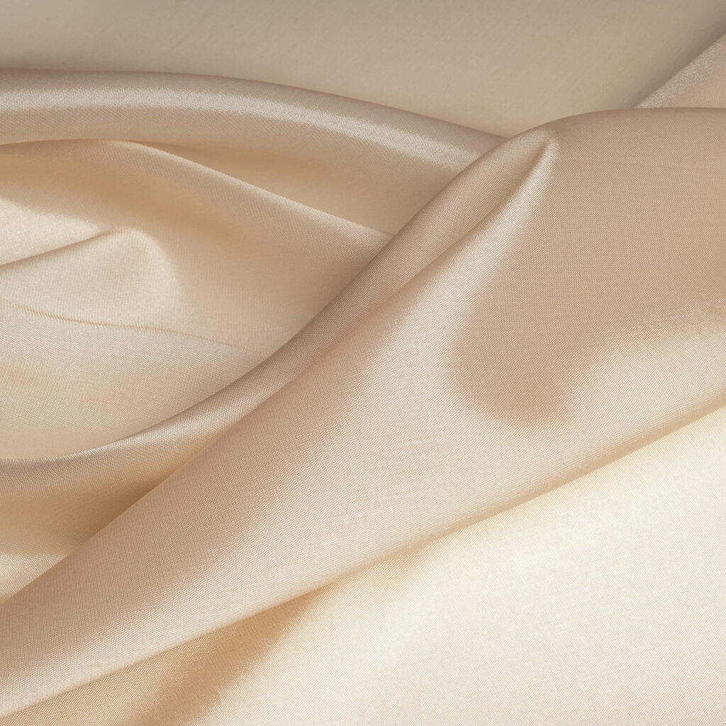 tissue, textile, cloth, fabric, material, texture. beige color. cloth, typically produced by weaving or knitting textile fibers.