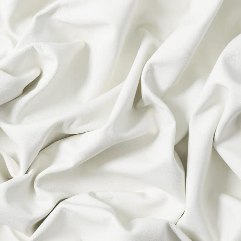 Closeup of light color leather material texture background