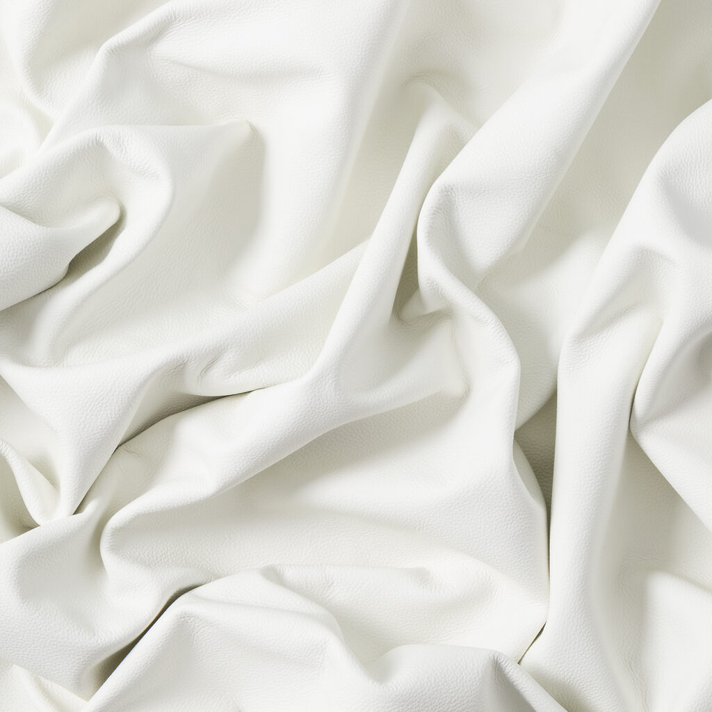 Closeup of light color leather material texture background