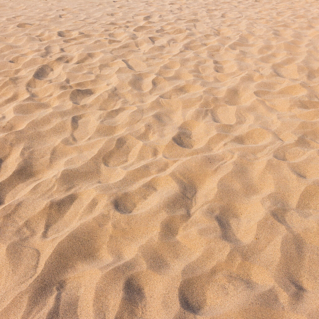 footmarks on sand and sand texture and background